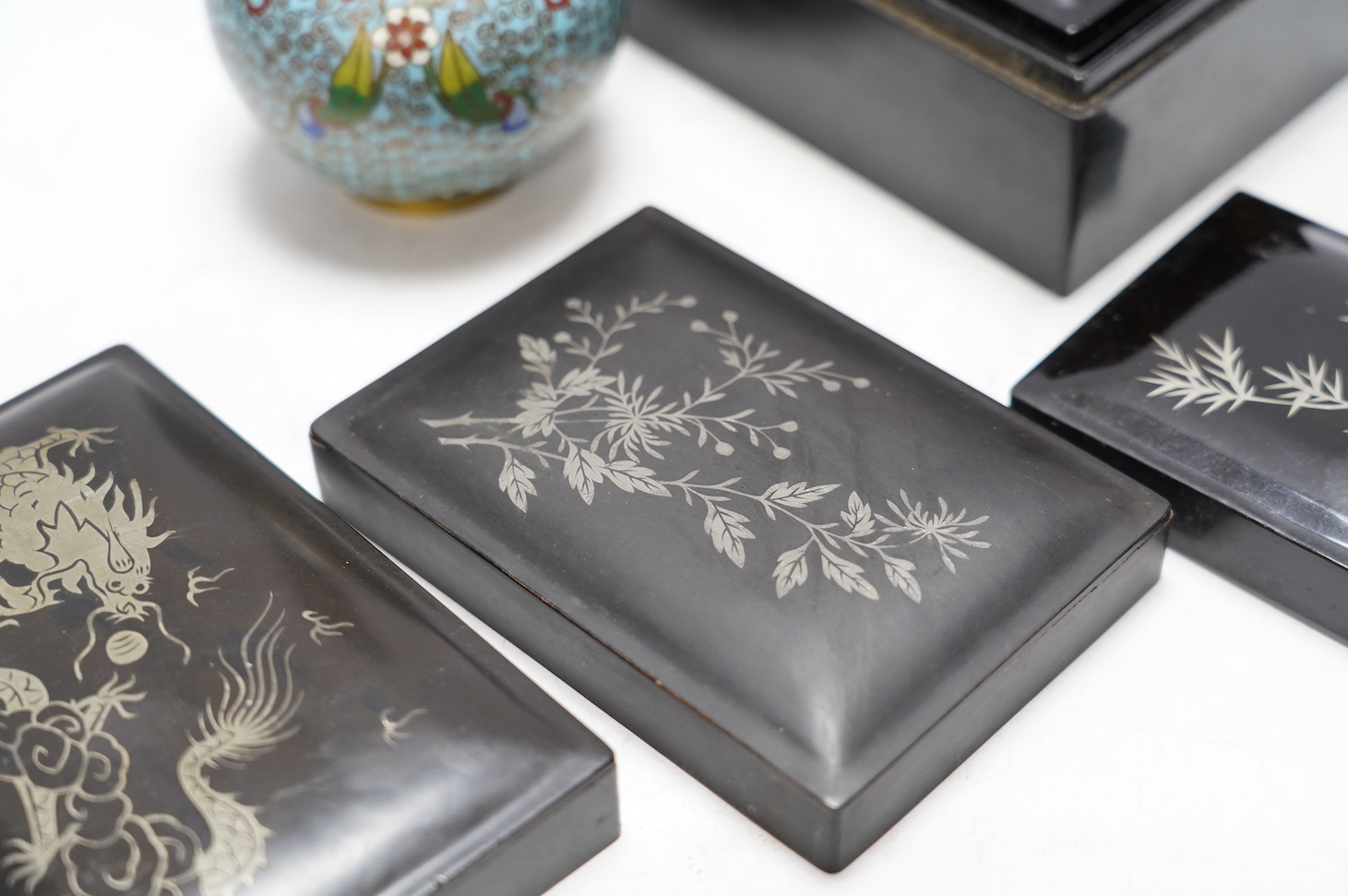 A Chinese cloisonné enamel vase, 13cm, and a set of five graduated lacquer boxes, the lids with inlaid silver decorations, largest 13.5 x 10 x 6.5cm. Condition - good